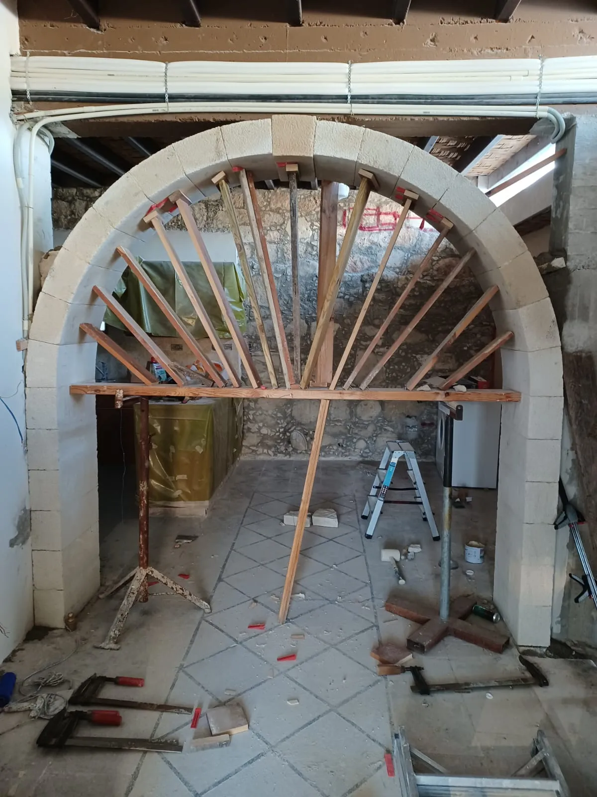 Hand-built stone arches inside a property renovation