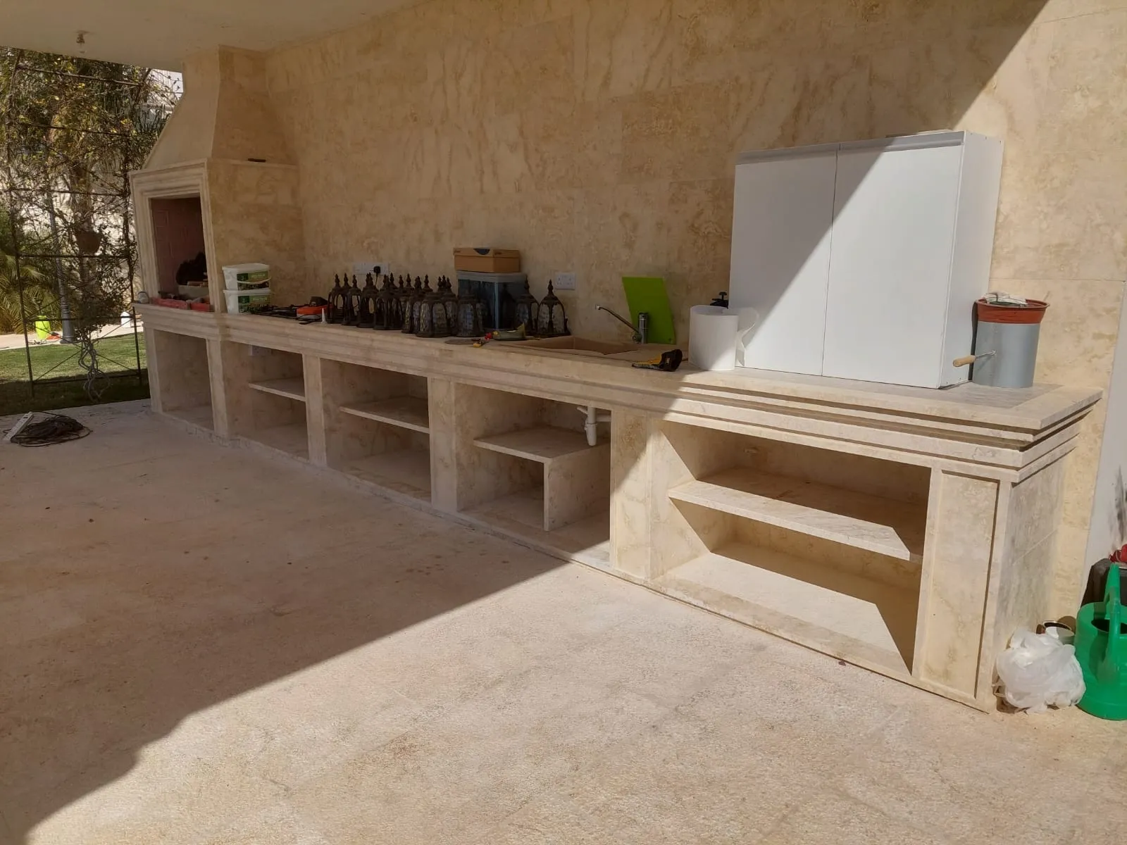Stone barbecue and worktop on a garden terrace
