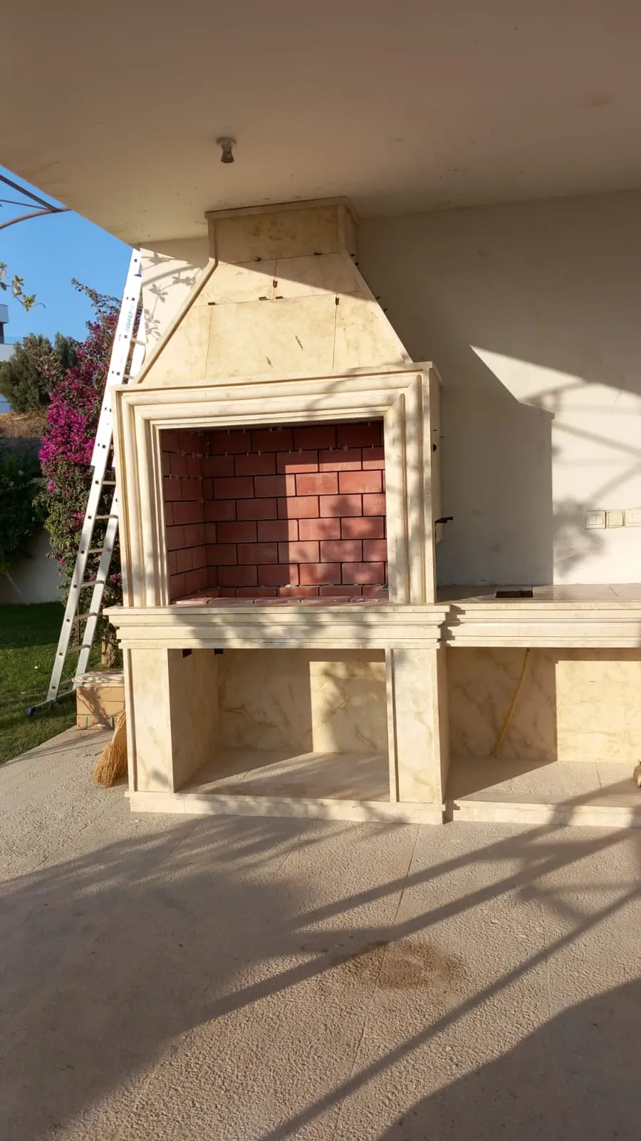 Stone barbecue built into a garden wall
