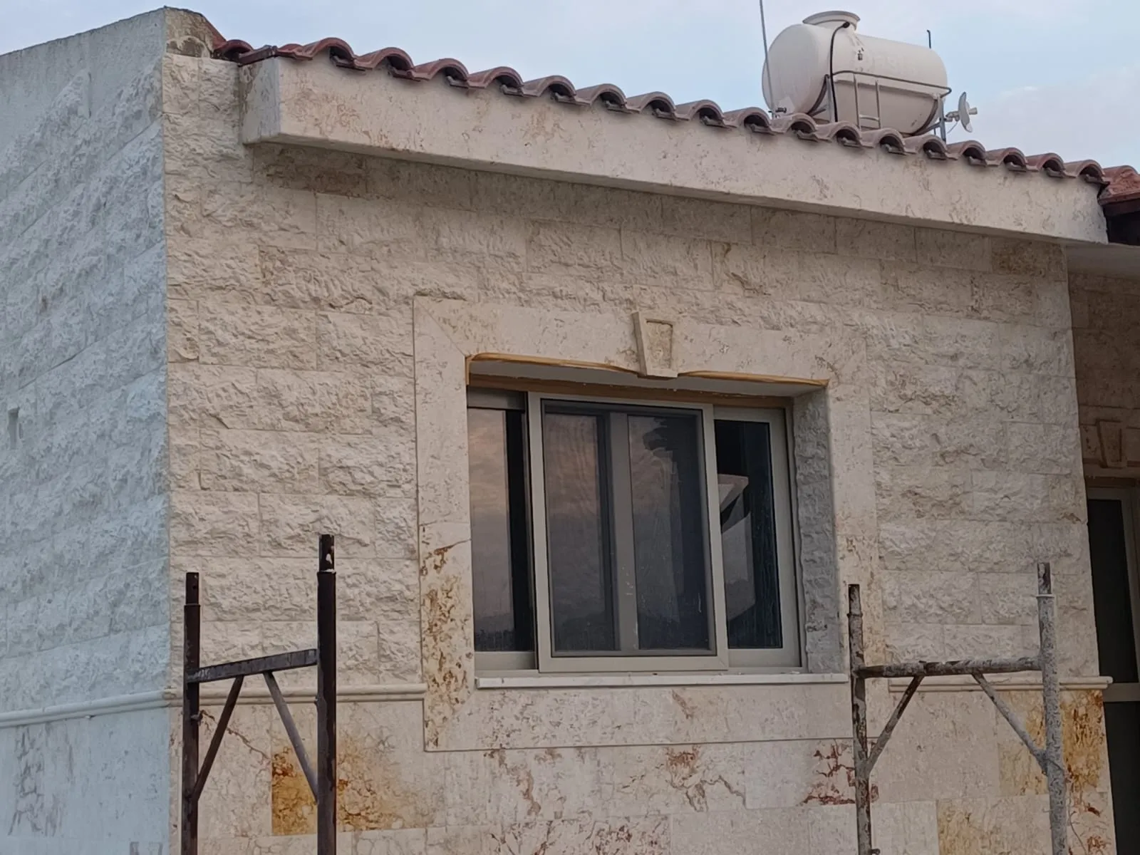 Stone-clad house facade in Cyprus