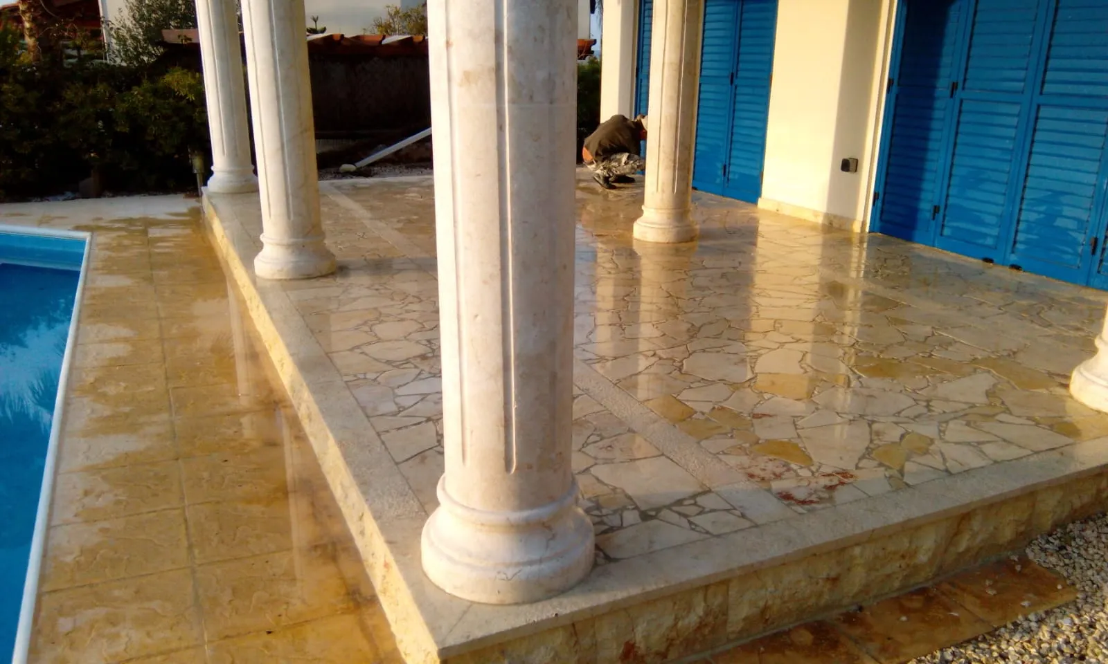 Marble columns beside a swimming pool terrace