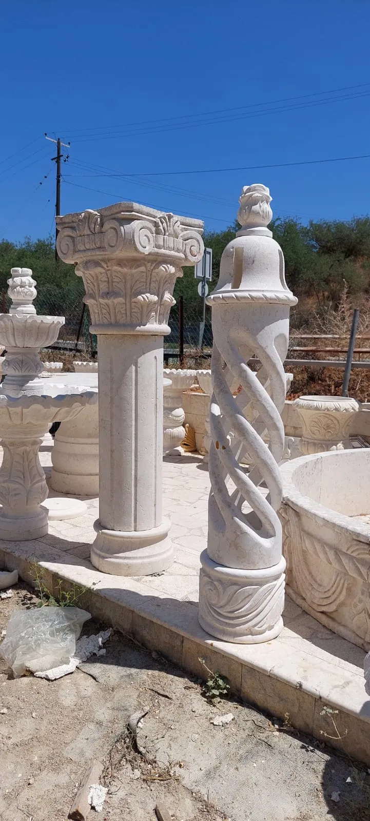 Spiral-carved stone columns in the workshop yard
