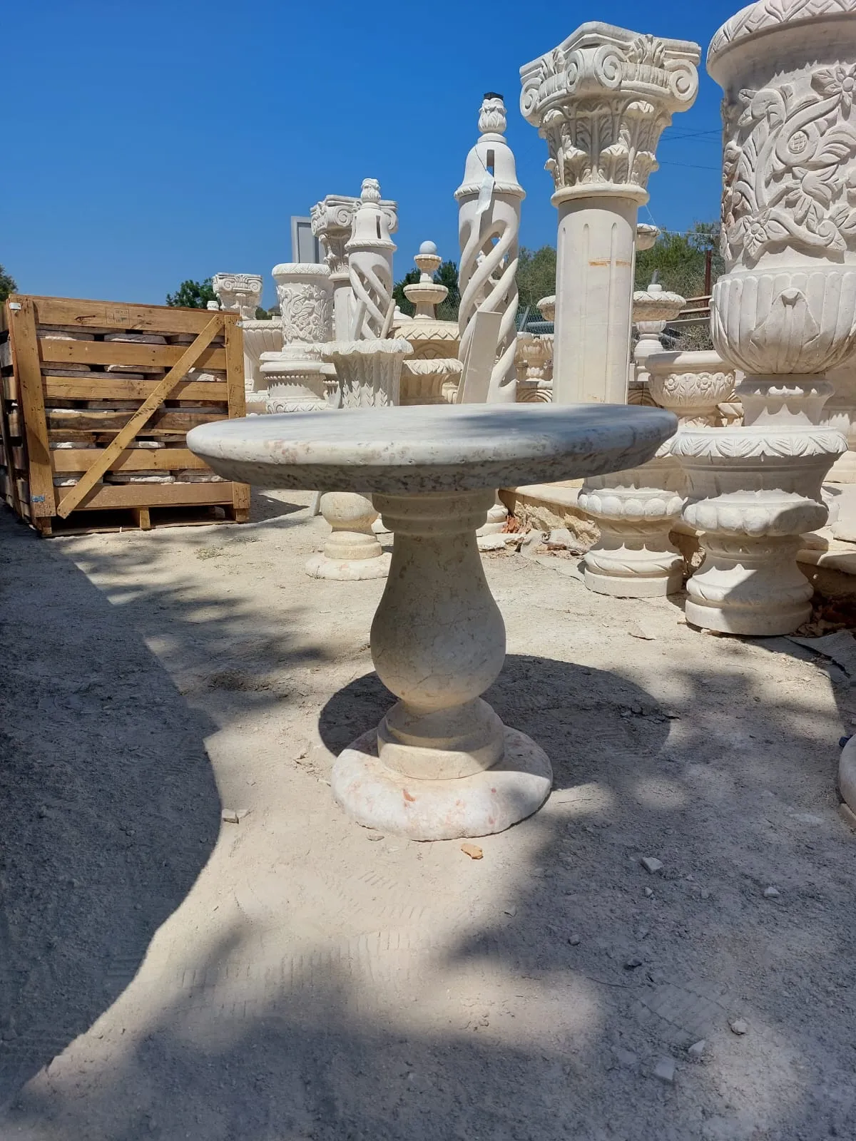 Stone fountain and carved pieces in the workshop yard