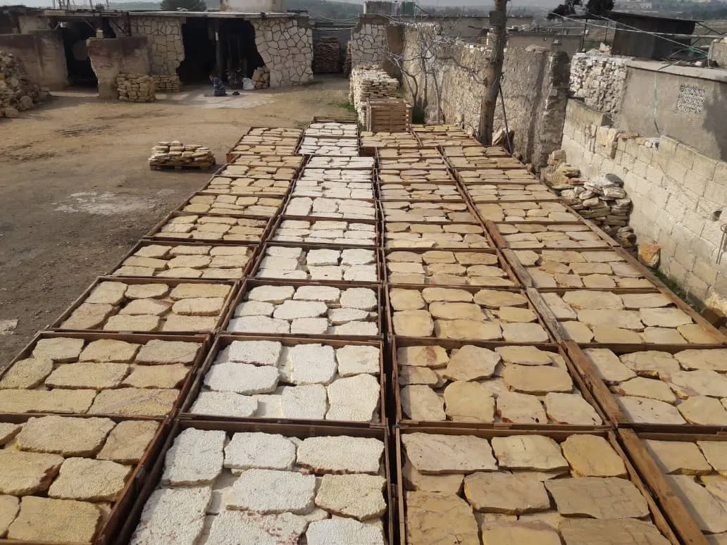 Natural stone paving slabs laid out in the yard