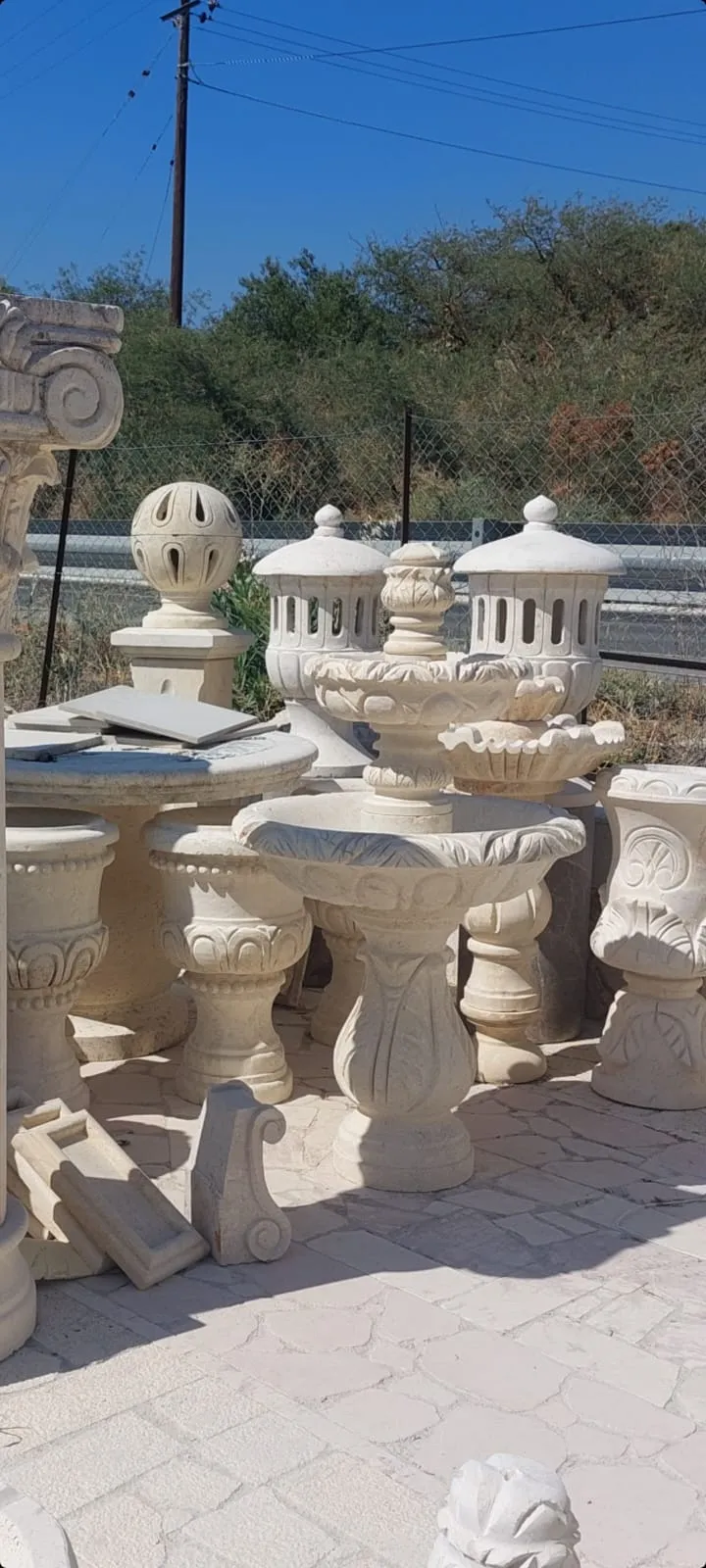 Fountains, lanterns and planters in the workshop yard